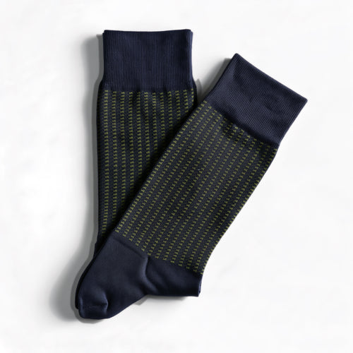 Green jacquard crew socks, navy with a green pattern, pair laid flat on white