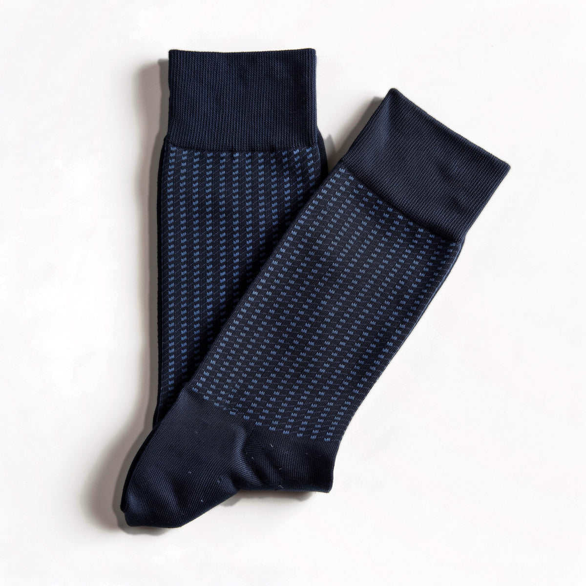 Navy jacquard crew socks, pair laid flat on white