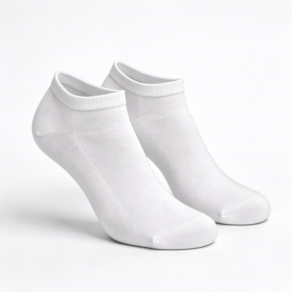 White no-show trainer socks, pair standing on a white background
